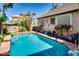 Pool with a covered seating area and desert landscape at 16026 N 171St Ln, Surprise, AZ 85388