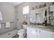 Updated bathroom features granite countertop, a walk-in shower, and new fixtures at 16137 W Quail Creek Ln, Surprise, AZ 85374