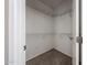 Walk-in closet with carpeted floor and wire shelving for ample storage at 16137 W Quail Creek Ln, Surprise, AZ 85374