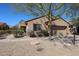 Charming single-story home featuring a well-manicured yard and desert landscaping at 16137 W Quail Creek Ln, Surprise, AZ 85374