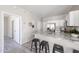 Stylish kitchen with a breakfast bar, stainless steel appliances, and modern finishes at 16137 W Quail Creek Ln, Surprise, AZ 85374
