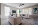 Spacious living room with lots of natural light, plush sofas, and modern decor at 16137 W Quail Creek Ln, Surprise, AZ 85374