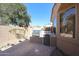 Built-in outdoor grill with countertop space, mini-fridge, and low-maintenance desert landscaping at 16137 W Quail Creek Ln, Surprise, AZ 85374