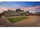 Large backyard area featuring a brick-lined artificial turf area and a wooden fence at 1642 E Turney Ave, Phoenix, AZ 85016