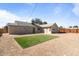 Expansive backyard featuring desert landscaping and a small patch of lush, green artificial turf at 1642 E Turney Ave, Phoenix, AZ 85016
