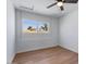 Bright bedroom with a ceiling fan, a window and hardwood flooring at 1642 E Turney Ave, Phoenix, AZ 85016
