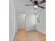 Bedroom with hardwood floors, ceiling fan, and a window looking out to the backyard at 1642 E Turney Ave, Phoenix, AZ 85016