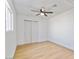 Bedroom features hardwood flooring, a ceiling fan and a closet at 1642 E Turney Ave, Phoenix, AZ 85016