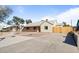 Single-story home with concrete driveway and desert landscaping in front at 1642 E Turney Ave, Phoenix, AZ 85016