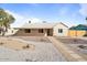Lovely single-story home with neutral paint, a covered porch, and desert landscaping at 1642 E Turney Ave, Phoenix, AZ 85016