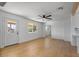 Well-lit living area with wood-look floors, modern ceiling fan, and plenty of natural light at 1642 E Turney Ave, Phoenix, AZ 85016
