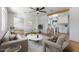 Bright living room with modern decor open to a beautiful white kitchen with bar seating at 1642 E Turney Ave, Phoenix, AZ 85016