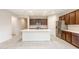 Bright kitchen with stainless steel appliances, white countertops, and ample cabinet space at 16721 W Whispering Wind Dr, Surprise, AZ 85387