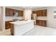 Spacious kitchen with a large island, stainless steel appliances, and plenty of cabinet space at 16721 W Whispering Wind Dr, Surprise, AZ 85387