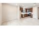 Eat-in kitchen features stainless steel appliances, tile floors, lots of counter space, and ample room at 16721 W Whispering Wind Dr, Surprise, AZ 85387
