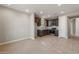 Open kitchen featuring dark cabinets, stainless steel appliances, and tile flooring at 16735 W Whispering Wind Dr, Surprise, AZ 85387
