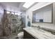 Modern bathroom featuring a glass-enclosed shower with stone-style tiling at 1699 Leisure World --, Mesa, AZ 85206