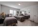 Bright bedroom with twin beds, a mirrored closet, and tile flooring at 1699 Leisure World --, Mesa, AZ 85206