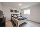 Cozy bedroom with neutral tones, tile floor, and decoratively framed artwork at 1699 Leisure World --, Mesa, AZ 85206