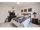 Well-lit bedroom showcasing tile flooring and framed decorations at 1699 Leisure World --, Mesa, AZ 85206
