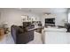Spacious living room showcasing multiple seating options and seamless flow to other living spaces at 1699 Leisure World --, Mesa, AZ 85206