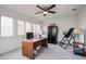 Bright office features a ceiling fan and large windows for ample natural light and tile flooring at 1699 Leisure World --, Mesa, AZ 85206