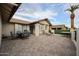 Expansive outdoor patio, perfect for entertaining, with a dining table and lounge chairs at 1699 Leisure World --, Mesa, AZ 85206