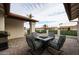Outdoor patio with table and seating offers a relaxed space with views of the surrounding neighborhood at 1699 Leisure World --, Mesa, AZ 85206