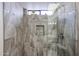 Modern shower with gray tiled walls, a showerhead, and a glass enclosure at 1699 Leisure World --, Mesa, AZ 85206