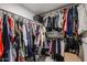 A large walk-in closet with shelving and rods to hang clothes and store personal items at 1699 Leisure World --, Mesa, AZ 85206