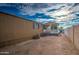 The backyard has desert landscaping and a small white porch with a blue trash bin at 17841 N 20Th St, Phoenix, AZ 85022