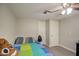 This bedroom has a fan, and lots of light with two entrances at 17841 N 20Th St, Phoenix, AZ 85022