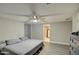 This bedroom has a light gray color scheme with a view of the en-suite bathroom at 17841 N 20Th St, Phoenix, AZ 85022