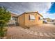 Exterior view of the house with desert landscaping, gray pavers, and a white porch at 17841 N 20Th St, Phoenix, AZ 85022
