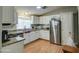Eat-in kitchen features granite counters, stainless appliances, and white cabinetry at 17841 N 20Th St, Phoenix, AZ 85022