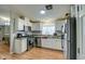 Eat-in kitchen features granite counters, stainless appliances, and white cabinetry at 17841 N 20Th St, Phoenix, AZ 85022