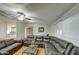 Spacious open living room featuring a large leather sectional and neutral walls at 17841 N 20Th St, Phoenix, AZ 85022