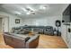 Large open living room, with leather seating, ceiling fan and recessed lighting at 17841 N 20Th St, Phoenix, AZ 85022