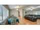 Open-concept dining and living area with laminate floors and lots of light at 17841 N 20Th St, Phoenix, AZ 85022