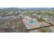 Wide aerial shot of home featuring pool, neutral palette and mountain views in the background at 1819 W Joy Ranch Rd, Phoenix, AZ 85086