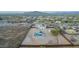 Expansive shot of home showcasing private pool, surrounding desert and privacy fence at 1819 W Joy Ranch Rd, Phoenix, AZ 85086
