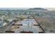 Bird's eye view of a desert home showcasing pool, neutral palette and mountain views at 1819 W Joy Ranch Rd, Phoenix, AZ 85086