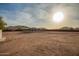 Large desert backyard featuring a gazebo, privacy fence, mountain views and a metal storage shed at 1819 W Joy Ranch Rd, Phoenix, AZ 85086