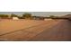Expansive dirt backyard featuring a gazebo with concrete pad, ready for customization and outdoor enjoyment at 1819 W Joy Ranch Rd, Phoenix, AZ 85086