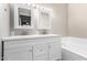 Bright bathroom featuring a double sink vanity, modern fixtures, and a relaxing bathtub at 1819 W Joy Ranch Rd, Phoenix, AZ 85086
