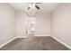 Bedroom features neutral carpet, beige walls, ceiling fan, and ensuite bathroom at 1819 W Joy Ranch Rd, Phoenix, AZ 85086