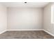This bedroom with neutral walls and carpet is bathed in natural light at 1819 W Joy Ranch Rd, Phoenix, AZ 85086