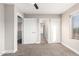 A bedroom featuring multiple doors and windows for natural light at 1819 W Joy Ranch Rd, Phoenix, AZ 85086