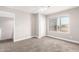 Neutral bedroom featuring a ceiling fan, window and soft carpet at 1819 W Joy Ranch Rd, Phoenix, AZ 85086