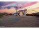 A desert home with two palm trees and a two car garage at 1819 W Joy Ranch Rd, Phoenix, AZ 85086